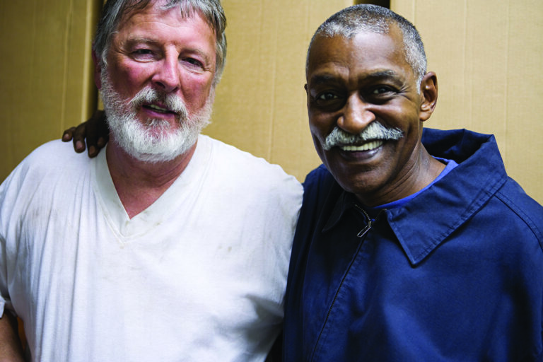 two men in community program