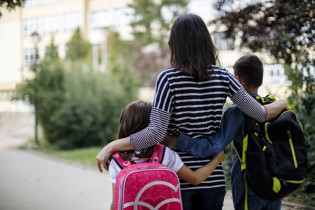 Mother taking kids to school