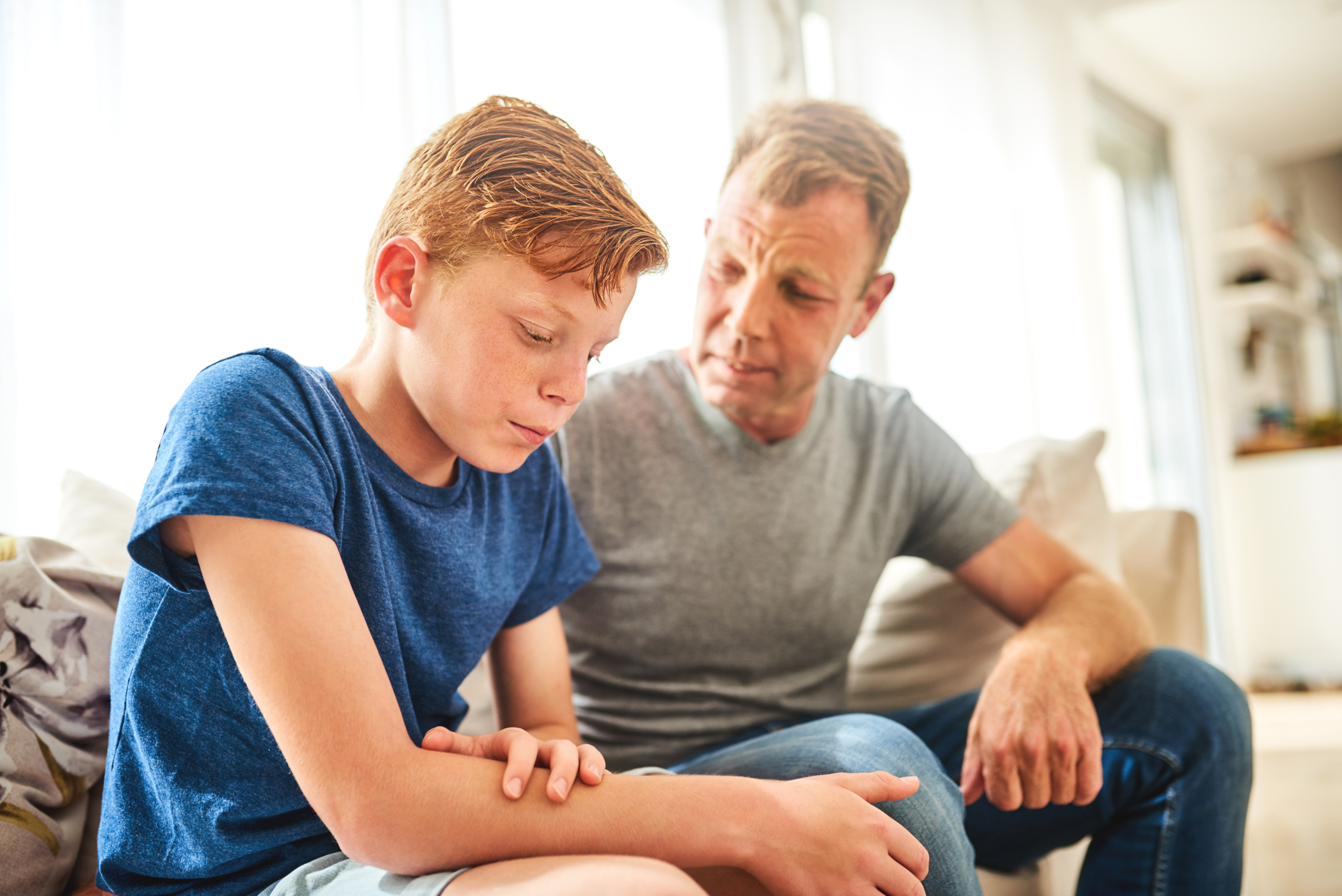 Father reprimanding son.