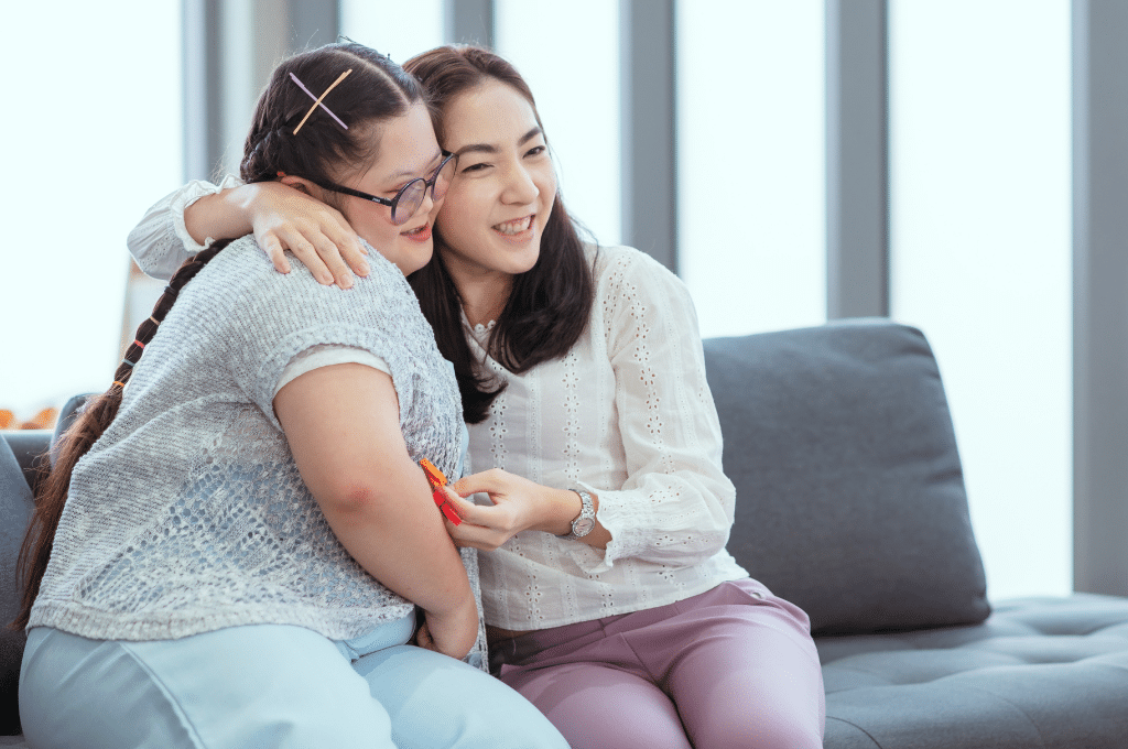 Mother embracing daughter