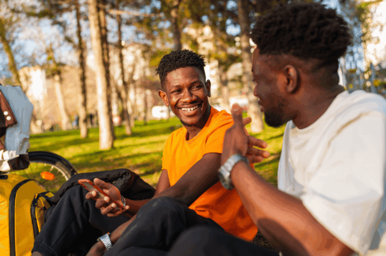 Two men talking outside