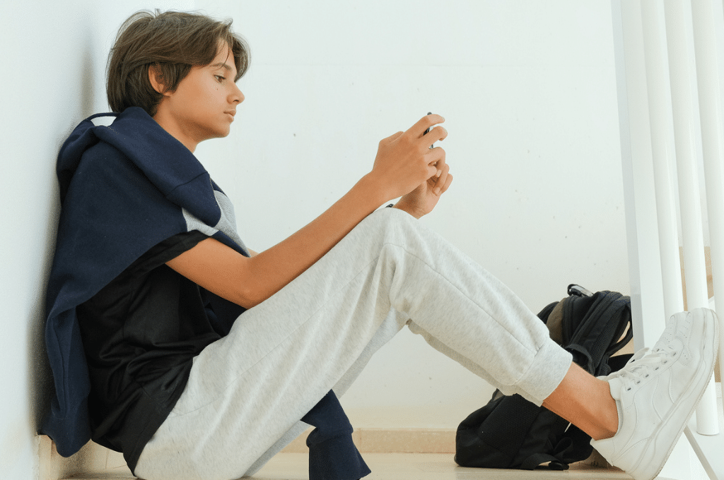 Teenager using phone