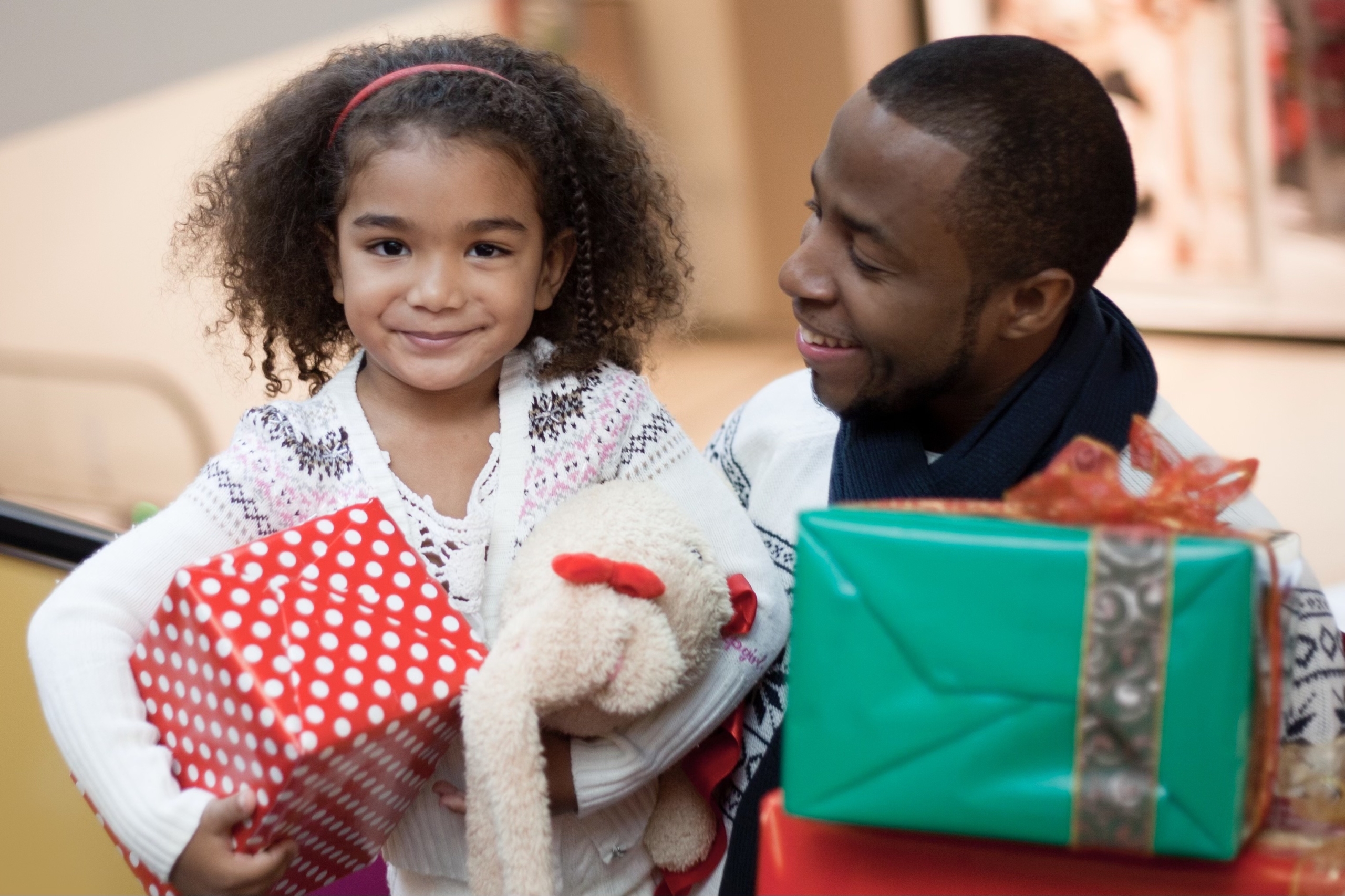 dad and daughter with presents