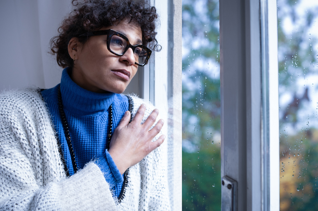 Woman looking out window