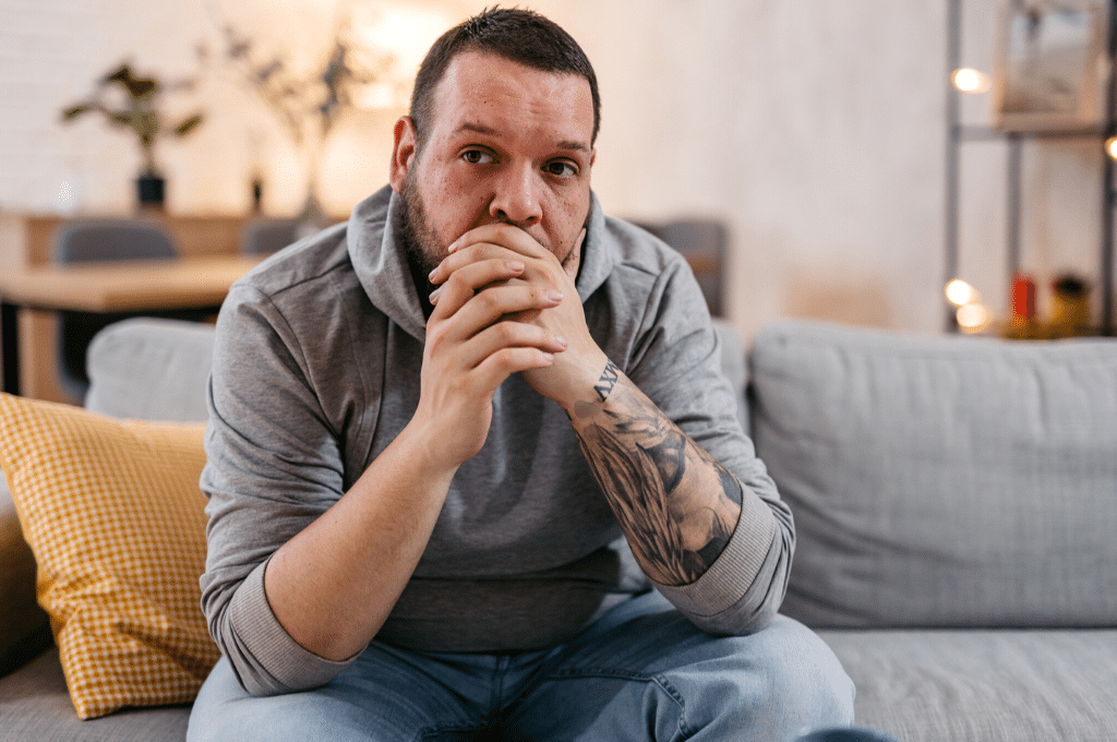 Man thinking on couch