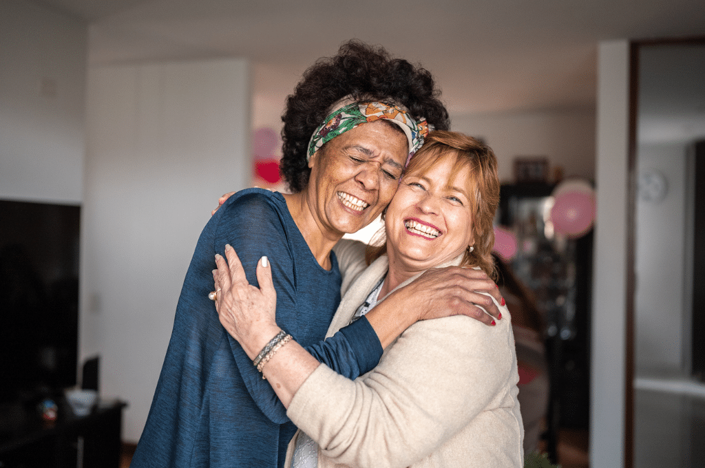 2 women laughing together