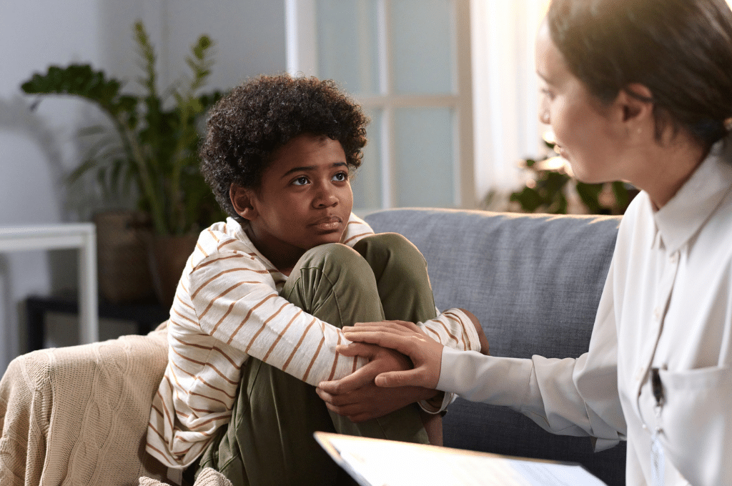 Boy talking to social worker