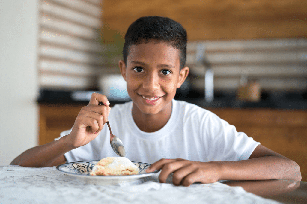 Boy eating at home