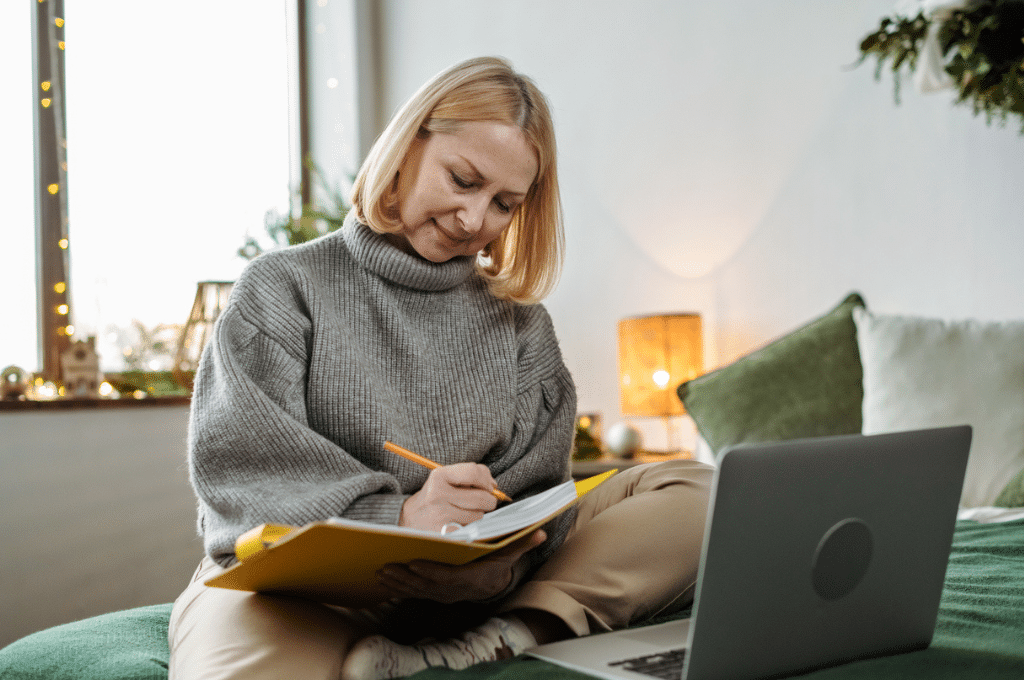 Woman writing in notebook