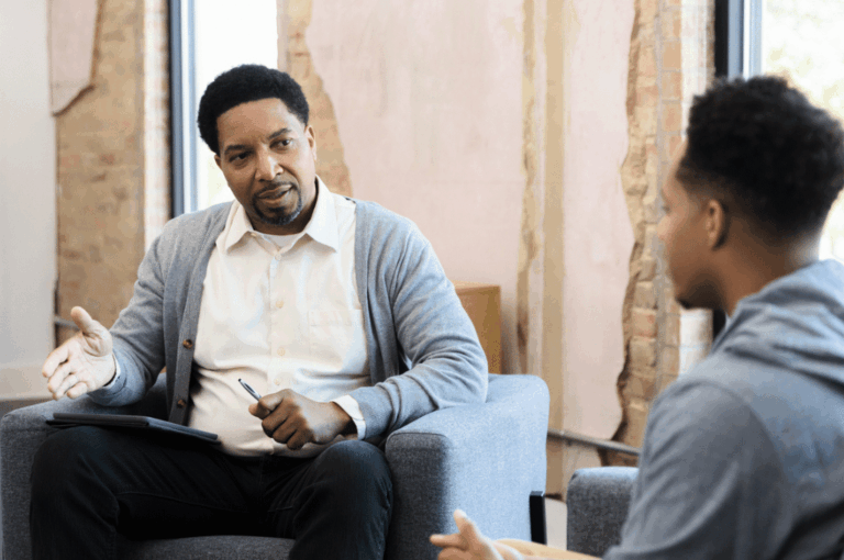 Young man talking to psychiatrist