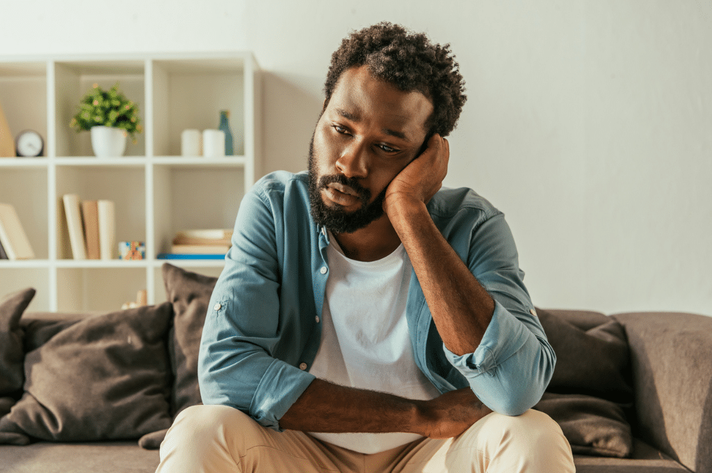 Man sad on couch