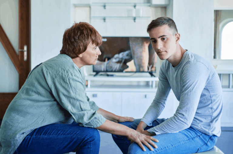 Mother talking to son at home