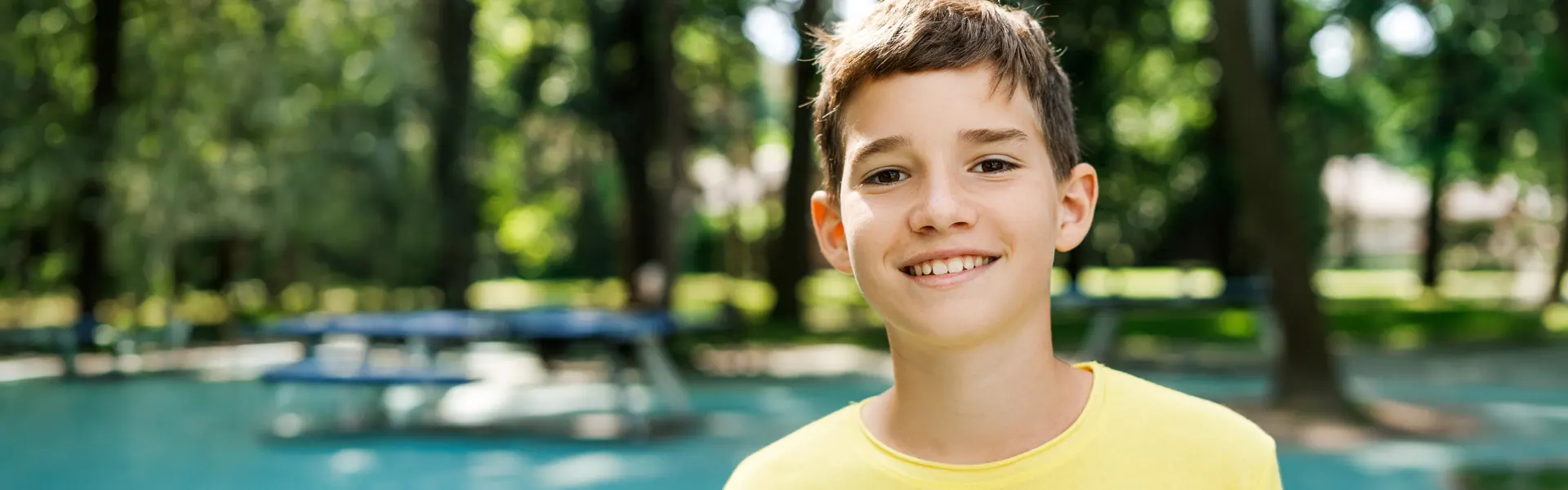 Smiling Boy in a Park