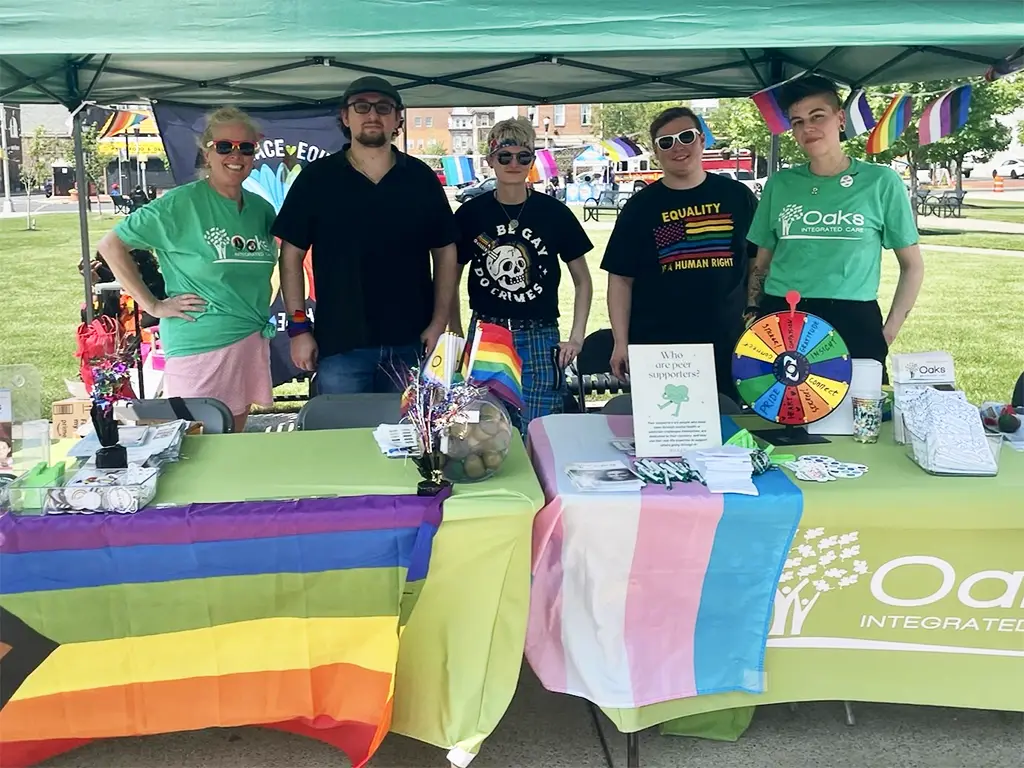 Oaks Employees at a Pride event table