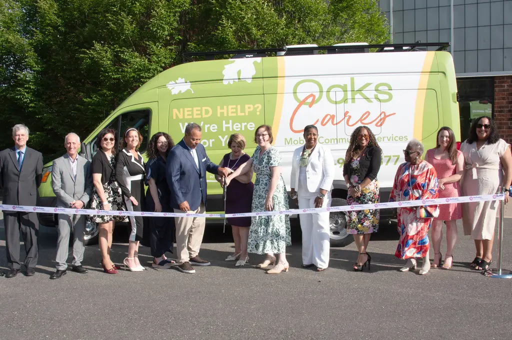Photo of the Oaks Mobile Van and staff ribbon cutting