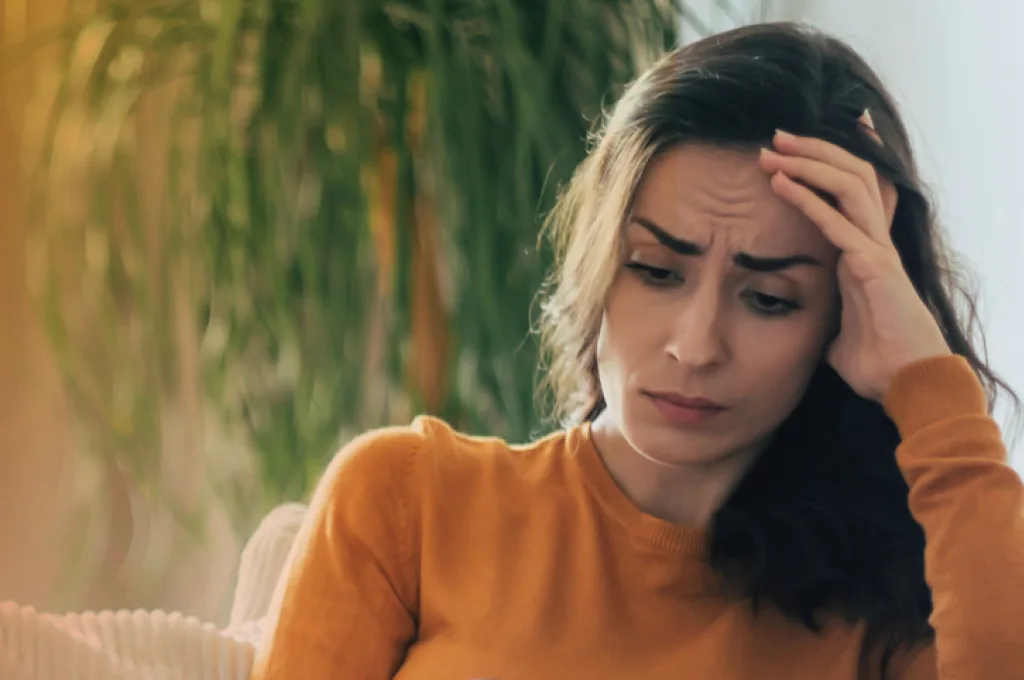 Sad Woman with her hand on her head